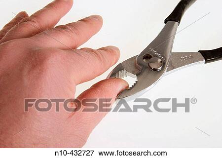 Pliers holding onto a person's thumb View Large Photo Image Stock Photo - Pliers holding onto a person's thumb. Fotosearch