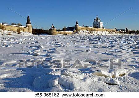 Stock Image - Ploskaya flat Tower, Kutekroma Tower, High or Ressurection Tower and Holy Trinity Cathedral (1699) by Velikaya River, Kremlin, Pskov, Russia. Fotosearch
