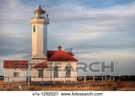 Stock Photo - Point Wilson Lighthouse at golden hour. Fotosearch