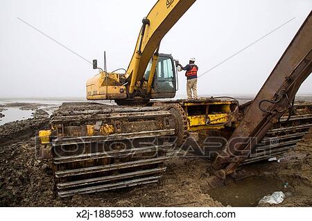 Pointe a la Hache, Louisiana - Earth-moving equipment at the Lake Hermitage Marsh Creation project View Large Photo Image Stock Image - Pointe a la Hache, Louisiana - Earth-moving equipment at the Lake Hermitage Marsh Creation project. Fotosearch