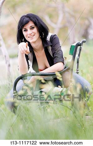 Pointing with a finger in the park attractive young woman View Large Photo Image Stock Image - Pointing with a finger in the park attractive young woman. Fotosearch