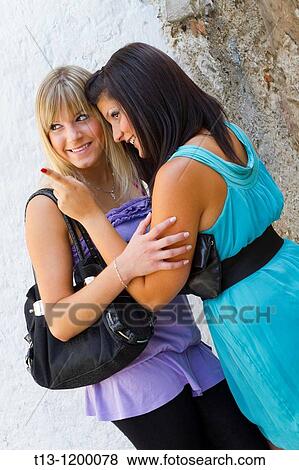 Pointing with a forefinger to someone, two young women together View Large Photo Image Stock Photo - Pointing with a forefinger to someone, two young women together. Fotosearch