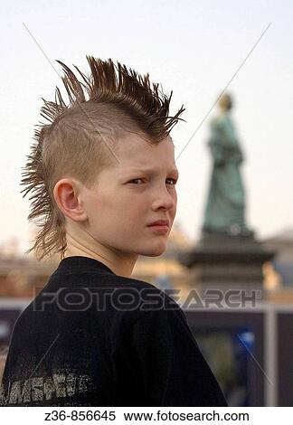Poland, Krakow, boy at Main Market Square View Large Photo Image Stock Photography - Poland, Krakow, boy at Main Market Square. Fotosearch