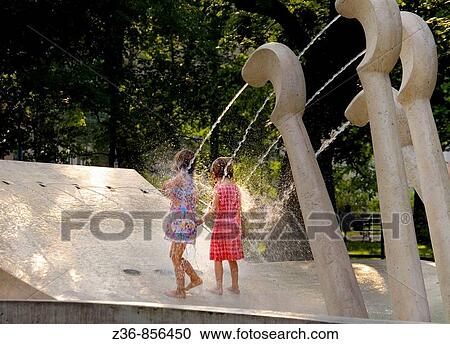 Poland, Krakow, Cooling off by fountain named? Chopin's piano?, Planty park, summer View Large Photo Image Stock Image - Poland, Krakow, Cooling off by fountain named? Chopin's piano?, Planty park, summer. Fotosearch