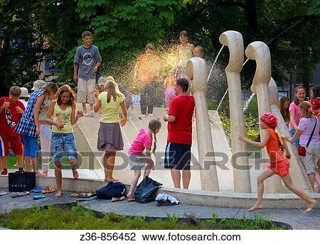 Poland, Krakow, Cooling off by fountain named? Chopin's piano?, Planty park, summer View Large Photo Image Stock Image - Poland, Krakow, Cooling off by fountain named? Chopin's piano?, Planty park, summer. Fotosearch
