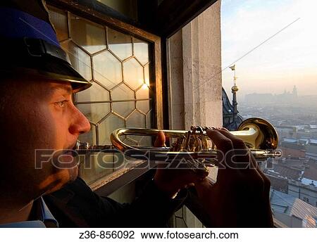 Poland Krakow Every hour trumpeter plays anthem from St Mary's Church Tower View Large Photo Image Stock Image - Poland Krakow Every hour trumpeter plays anthem from St Mary's Church Tower. Fotosearch