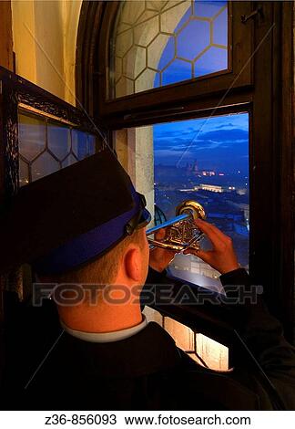 Stock Image - Poland Krakow Every hour trumpeter plays anthem from St Mary's Church Tower. Fotosearch