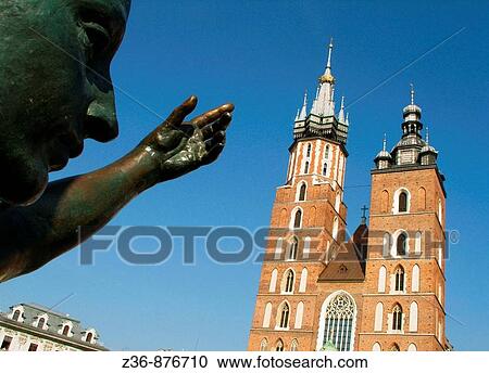 Poland, Krakow, Monument of great Polish poet Adam Mickiewicz, detail and St mary's Basilica View Large Photo Image Stock Image - Poland, Krakow, Monument of great Polish poet Adam Mickiewicz, detail and St mary's Basilica. Fotosearch