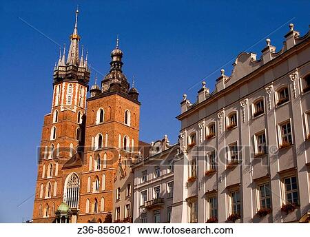 Stock Image - Poland, Krakow, St Mary's Church at Main Market Square. Fotosearch