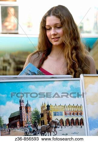 Poland Krakow, young woman by a paintings View Large Photo Image Stock Image - Poland Krakow, young woman by a paintings. Fotosearch