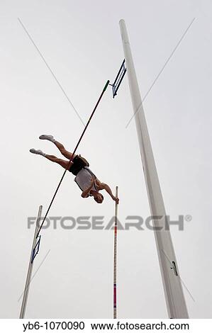 Pole Vaulter attempting to clear the bar, Arc de triomf Competition, Barcelona, Spain View Large Photo Image Stock Image - Pole Vaulter attempting to clear the bar, Arc de triomf Competition, Barcelona, Spain. Fotosearch