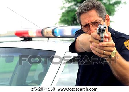 Police officer aiming gun prepared to shoot. View Large Photo Image Stock Image - Police officer aiming gun prepared to shoot.. Fotosearch
