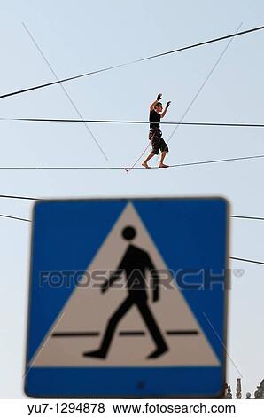 Stock Photo - Polish slackliner Damian Czermak during show in Warsaw, Poland. Fotosearch