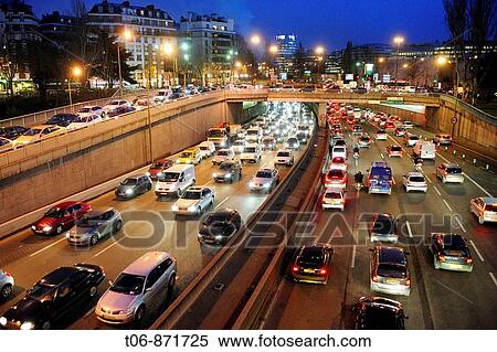 Pollution, traffic jam on parisian expressway, Peripherique at night, Porte de Saint Cloud, Paris, France View Large Photo Image Stock Photography - Pollution, traffic jam on parisian expressway, Peripherique at night, Porte de Saint Cloud, Paris, France. Fotosearch