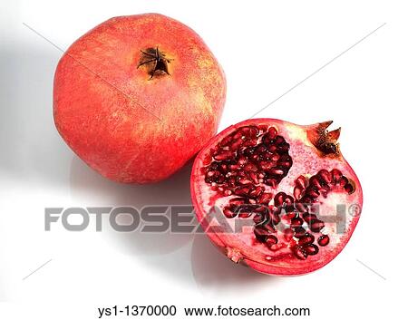 Stock Image - POMEGRANATA FRUIT punica granatum AGAINST WHITE BACKGROUND. Fotosearch