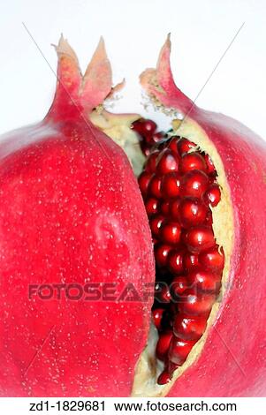 Stock Image - Pomegranates isolated on white background. Fotosearch