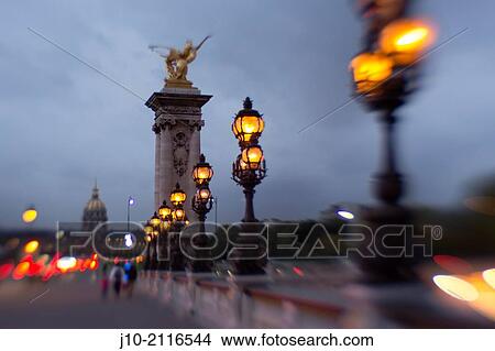 Pont Alexandre (1897), Paris, France (lens blur effect) evening. View Large Photo Image Picture - Pont Alexandre (1897), Paris, France (lens blur effect) evening.. Fotosearch