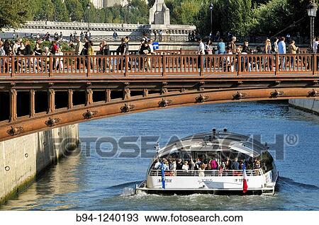 Pont au Double and Bateau-mouche, Seine river boat. Paris, France. View Large Photo Image Stock Image - Pont au Double and Bateau-mouche, Seine river boat. Paris, France.. Fotosearch