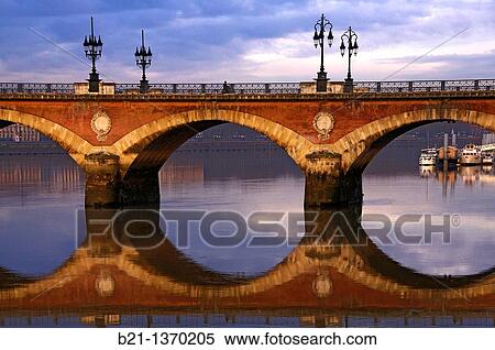 Pont de Pierre (stone bridge) over the Garonne river at Bordeaux, Gironde, Aquitaine, France View Large Photo Image Stock Photography - Pont de Pierre (stone bridge) over the Garonne river at Bordeaux, Gironde, Aquitaine, France. Fotosearch