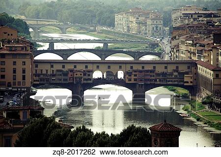 Stock Image - Ponte Vecchio, Florence with reflections in the Arno River.. Fotosearch