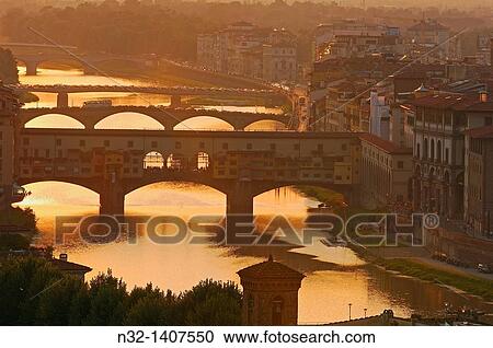 Ponte Vecchio over Arno river at sunset, Florence, Tuscany, Italy View Large Photo Image Stock Image - Ponte Vecchio over Arno river at sunset, Florence, Tuscany, Italy. Fotosearch