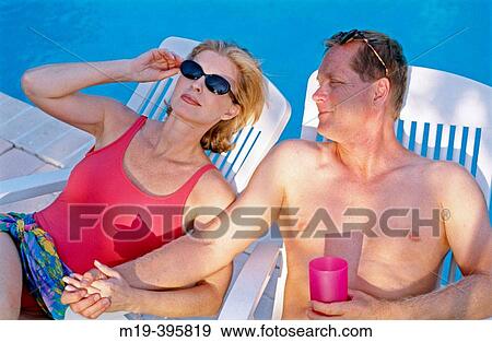 Stock Photo - poolside couple. Fotosearch