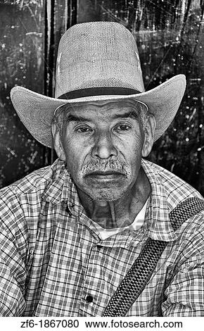 Poor man portrait in cowboy hat portrait in Lake Atitlan village of San Pedro Guatemala in Central America View Large Photo Image Stock Image - Poor man portrait in cowboy hat portrait in Lake Atitlan village of San Pedro Guatemala in Central America. Fotosearch