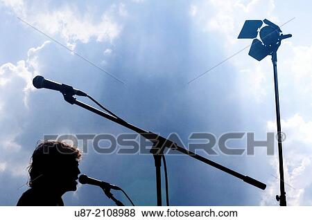 Popular Music Concert Stage and Musician Silhouette. View Large Photo Image Stock Photo - Popular Music Concert Stage and Musician Silhouette.. Fotosearch