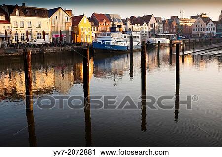 Stock Image - Port of Husum at dawn. Husum, North Friesian Islands, Schleswig-Holstein, Germany, Europe.. Fotosearch