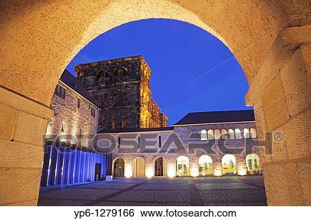 Porta Nigra with archway, illuminated at night, Trier, Germany View Large Photo Image Stock Photograph - Porta Nigra with archway, illuminated at night, Trier, Germany. Fotosearch
