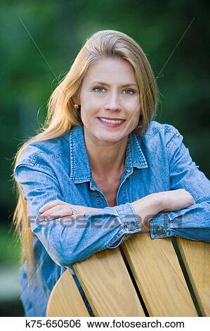 Stock Photograph - portait of long-haired woman outdoors. Fotosearch