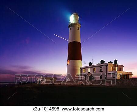 Portland Bill lighthouse at dusk on the Dorset Jurassic Coast, England, United Kingdom The planet Venus is seen traversing the night sky during a 1 hour long exposure View Large Photo Image Stock Photo - Portland Bill lighthouse at dusk on the Dorset Jurassic Coast, England, United Kingdom The planet Venus is seen traversing the night sky during a 1 hour long exposure. Fotosearch