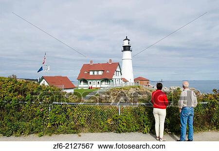 Portland Maine beautiful lighthouse called Portland Headlight with water and rocks on shore of lighthouse. View Large Photo Image Stock Photo - Portland Maine beautiful lighthouse called Portland Headlight with water and rocks on shore of lighthouse.. Fotosearch