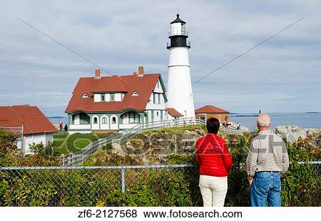 Portland Maine beautiful lighthouse called Portland Headlight with water and rocks on shore of lighthouse. View Large Photo Image Stock Photo - Portland Maine beautiful lighthouse called Portland Headlight with water and rocks on shore of lighthouse.. Fotosearch