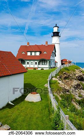 Portland Maine famous Head Light Lighthouse in USA on water with rocks and ocean on cliff. View Large Photo Image Stock Photograph - Portland Maine famous Head Light Lighthouse in USA on water with rocks and ocean on cliff.. Fotosearch