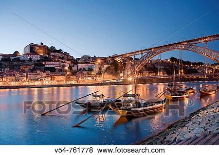 Porto Wine Carrying Barcos Barges, River Douro and city skyline, Porto UNESCO World Heritage, Portugal View Large Photo Image Stock Photo - Porto Wine Carrying Barcos Barges, River Douro and city skyline, Porto UNESCO World Heritage, Portugal. Fotosearch