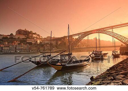 Porto Wine Carrying Barcos Barges, River Douro and city skyline, Porto UNESCO World Heritage, Portugal View Large Photo Image Stock Photo - Porto Wine Carrying Barcos Barges, River Douro and city skyline, Porto UNESCO World Heritage, Portugal. Fotosearch