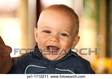Stock Image - Portrait a Young Boy smiling. Fotosearch