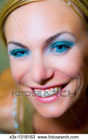 Stock Image - Portrait close-up of woman smiling. Fotosearch