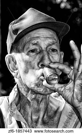 Portrait closeup of old man drinking in center park of Cienfuegos Cuba View Large Photo Image Stock Image - Portrait closeup of old man drinking in center park of Cienfuegos Cuba. Fotosearch