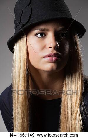 Stock Photo - Portrait of 19-20 year old woman. Fotosearch