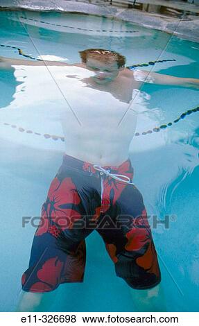 Portrait of 21 year old man in swimming pool View Large Photo Image Stock Photo - Portrait of 21 year old man in swimming pool. Fotosearch