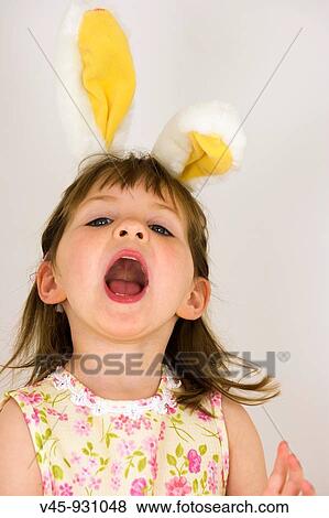 Portrait of 3 year old girl with bunny ears View Large Photo Image Stock Photo - Portrait of 3 year old girl with bunny ears. Fotosearch