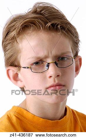 Portrait of a 10 year old annoyed boy View Large Photo Image Stock Photo - Portrait of a 10 year old annoyed boy. Fotosearch