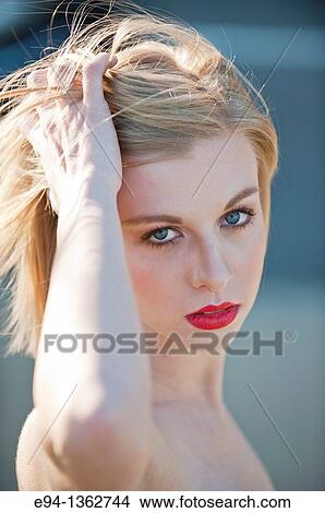 Portrait of a 19 year old blond woman looking directly at camera View Large Photo Image Picture - Portrait of a 19 year old blond woman looking directly at camera. Fotosearch