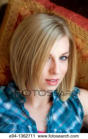 Stock Image - Portrait of a 19 year old blond woman.. Fotosearch