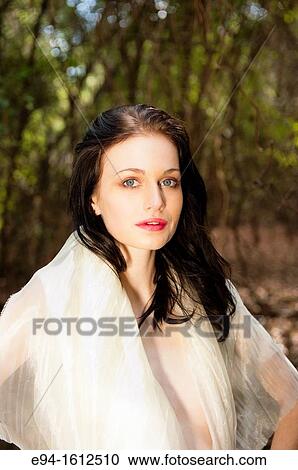 Portrait of a 20 year old brunettte woman wrapped in white fabric in a forest setting View Large Photo Image Stock Image - Portrait of a 20 year old brunettte woman wrapped in white fabric in a forest setting. Fotosearch