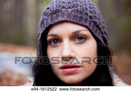 Portrait of a 20 year old brunettte woman wearing a knit hat outdoors View Large Photo Image Stock Image - Portrait of a 20 year old brunettte woman wearing a knit hat outdoors. Fotosearch