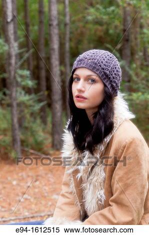 Portrait of a 20 year old brunettte woman wearing a knit hat and a leather coat in a forest View Large Photo Image Stock Photography - Portrait of a 20 year old brunettte woman wearing a knit hat and a leather coat in a forest. Fotosearch
