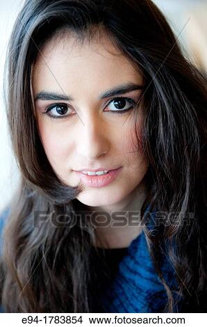 Portrait of a 21 year old brunette woman looking direrctly at the camera View Large Photo Image Picture - Portrait of a 21 year old brunette woman looking direrctly at the camera. Fotosearch